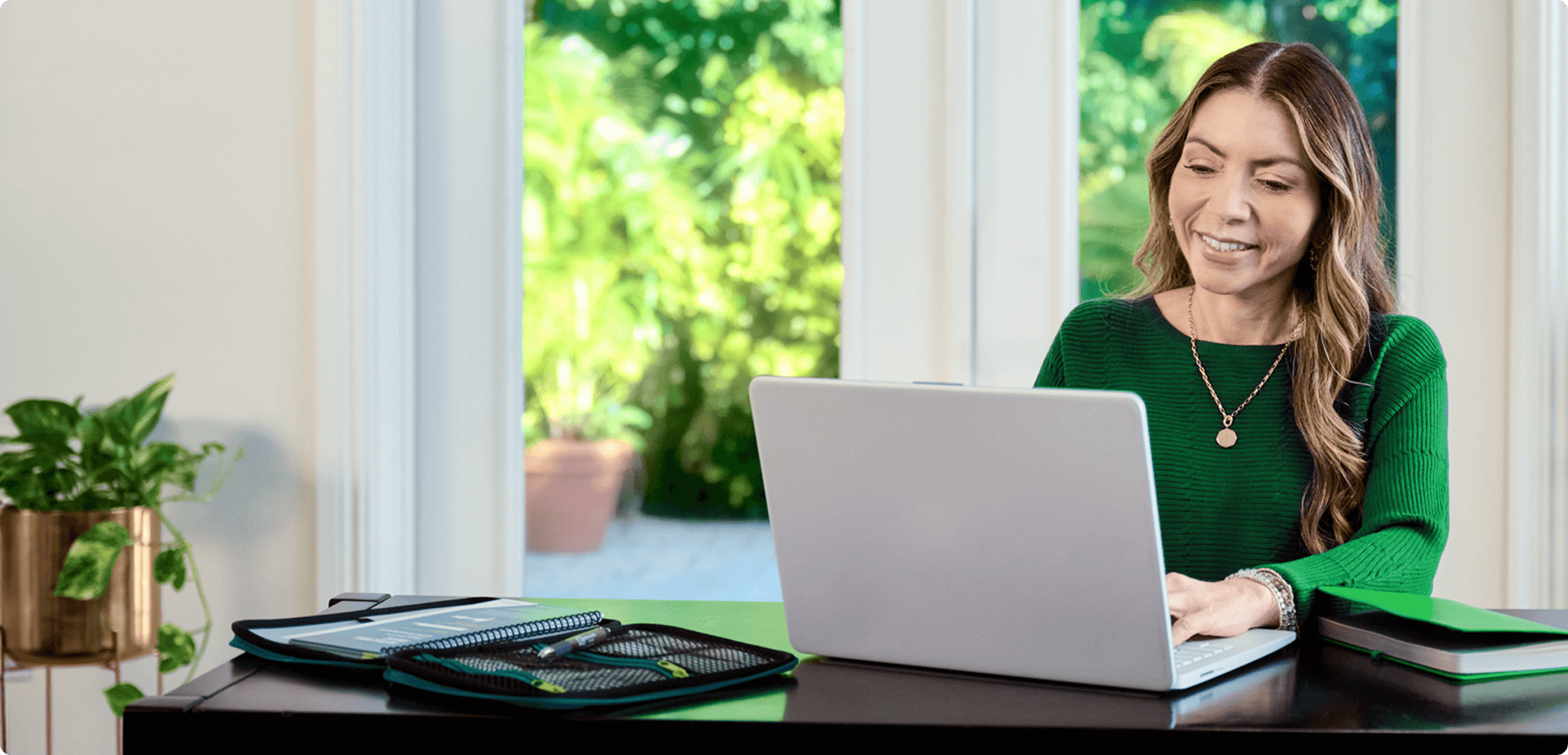 Nurse smiling at you from desk