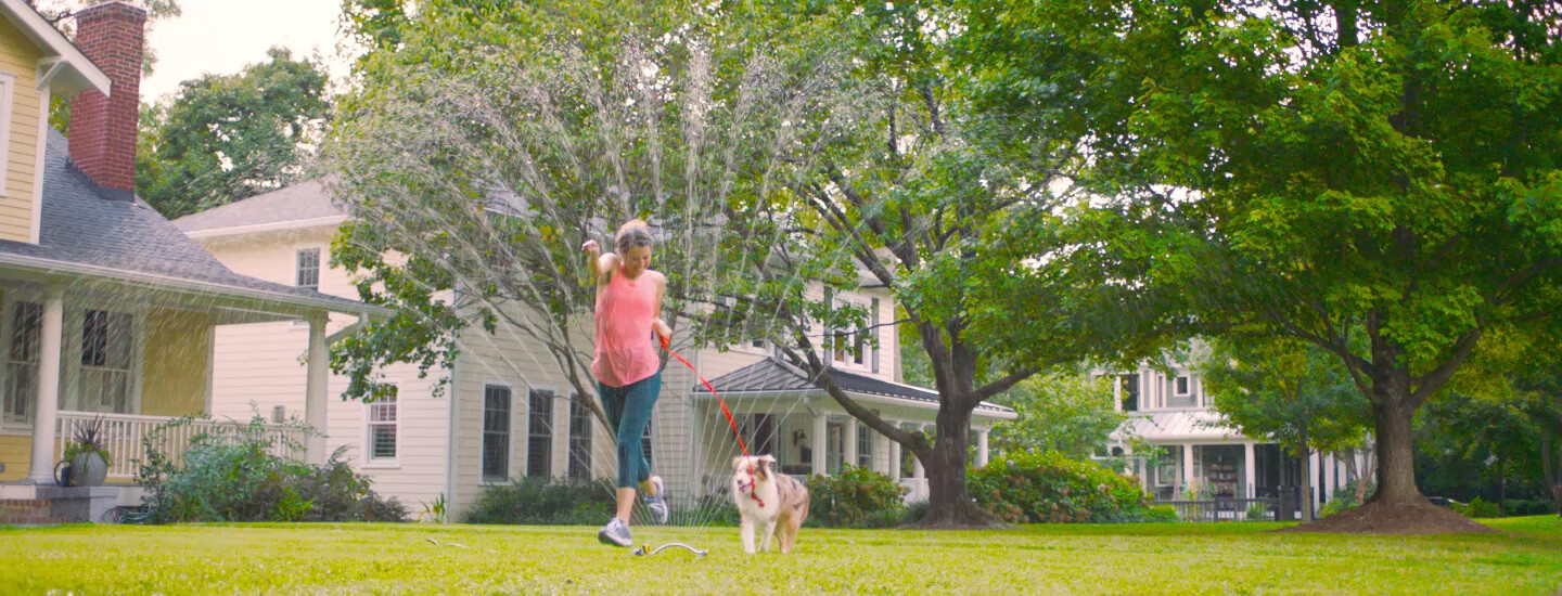 A CIMZIA® patient with psoriatic arthritis walking their dog